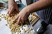 Maize being washed and cleaned by a chef