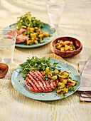 Grilled ham steak with grilled pineapple salsa and rocket salad
