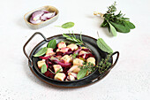 Ricotta gnocchi with endive, beets, and herbs
