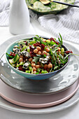 Salad with chickpeas, celery, arugula, and blue cheese