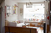Living room with colourful retro accessories and white decor