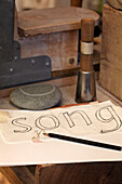Pencil sketch for stencil of word song in Brighton artisan's home, Sussex, UK
