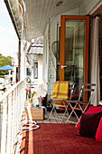 Folding chairs on veranda of houseboat in Richmond upon Thames, England, UK