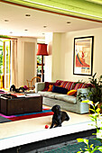 Seating area in living room of houseboat in Richmond upon Thames, England, UK