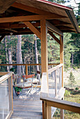 Table and chairs on a veranda with decking