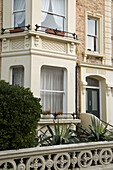 Exterior of Victorian town house with bay windows