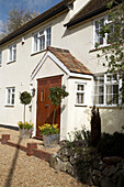 An exterior view of an entrance into traditional country house