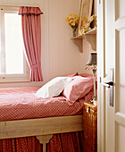 Bedroom with coordinating bed cover and curtains