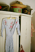 Vintage hat boxes on country style wardrobe in country style bedroom