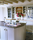 Kitchen with painted units and central island unit