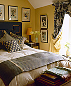 Double bed in yellow bedroom