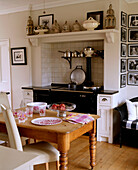 View of a traditional kitchen dining area with large wooden table