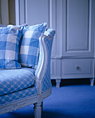 Detail of Gustavian sofa with blue and white check pattern upholstery