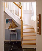 Hallway with painted panelling and model boat on table