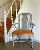 Hallway with painted Gustavian chair in Mjolby, Sweden