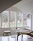 Bedroom with a painted floor and windows