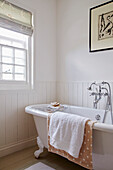 Freestanding bath in white panelled bathroom of Port Issac beach house Cornwall