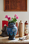 PInk roses in blue decorative urn Lot et Garonne, France