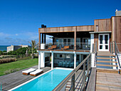 Holiday home exterior with swimming pool and balcony terrace