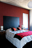 Oriental bedroom with red feature wall