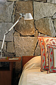 Lamp on nightstand with Indian fabric pillows