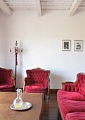 Armchairs and table in living room, Carmelo, Uruguay