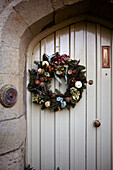 Seasonal wreath on front door of 1840s Victorian school house conversion