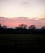 Sunset over farmland in winter