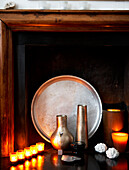 Lit candles and silverware in fireplace of Grade II listed Georgian townhouse in London