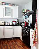 Retro styled kitchen with white fitted units in Edwardian terraced house Gateshead