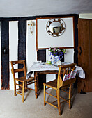 Table and chairs in timber framed Devon cottage