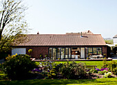 Barn conversion with open doors to back garden