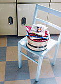1950s kitchen with pastel blue painted chair and cake tin
