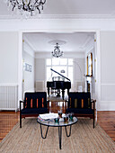 Grand piano and matching chairs in double reception of London home