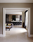 View through doorway to open plan kitchen and living room of townhouse