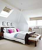 Brown leather bed in attic conversion of Harrogate home Yorkshire England UK