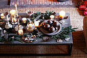 Lit candles and heart shaped ornaments on coffee table in festive Oxfordshire home, England, UK