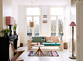 Contemporary living room with wooden sofa and chair, Amsterdam, Netherlands