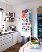 Recipe books and noticeboard in kitchen of Mattenbiesstraat family home, Netherlands