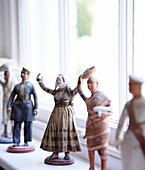 Figurines on windowsill in traditional country house Welsh borders UK