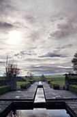 Modern water feature in grounds of Northumbrian manor house England UK