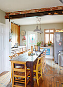 Long table in Sunderland kitchen with upright fridge Tyne and Wear England UK