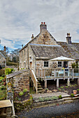 Decked terrace of Grade II listed Tudor bastle or fortified farmhouse Northumberland UK