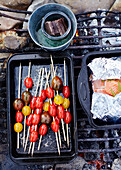 Salmon in silver foil with tomatoes on kebab skewers on County Sligo beach barbecue Connacht Ireland
