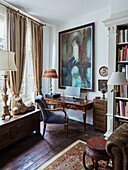 Antique desk and chair at window of Foix townhouse Ariege, France