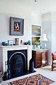 Hearth set and coal scuttle in fireplace of Northern home, UK