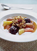 Bowl of fruit compote with muesli