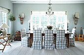 Dining room with loose covered dining chairs
