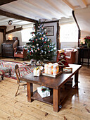 Christmas tree in open plan dining room of Herefordshire cottage, England, UK