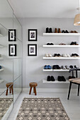 Shoe shelving and mirrored wardrobe with patterned rug in Reigate home Surrey